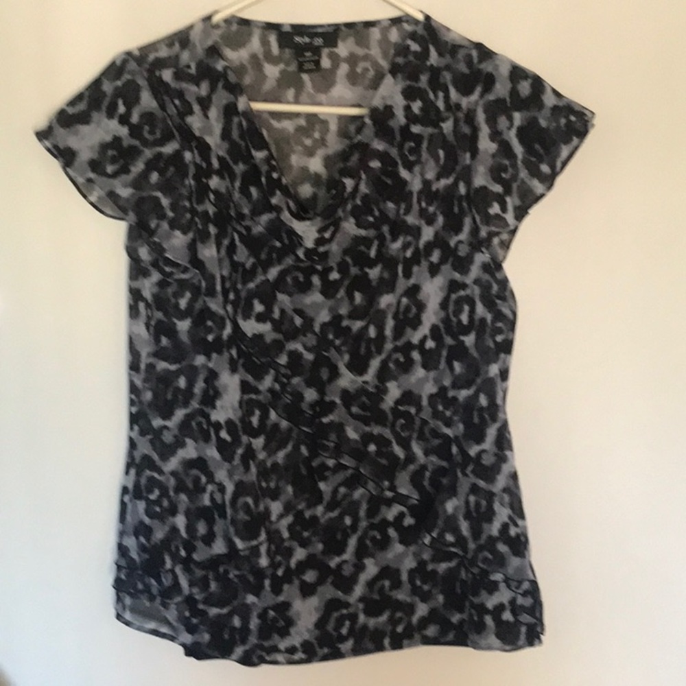 If you love ruffles you will love this top!  NWOT